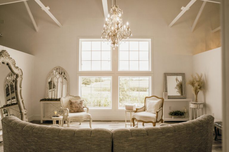 Cozy main room of the bridal suite at Fairview Acres with couch and mirrors.