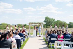 wide shot of ceremony outside venue