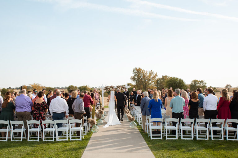 bride walking down the aisle with her father