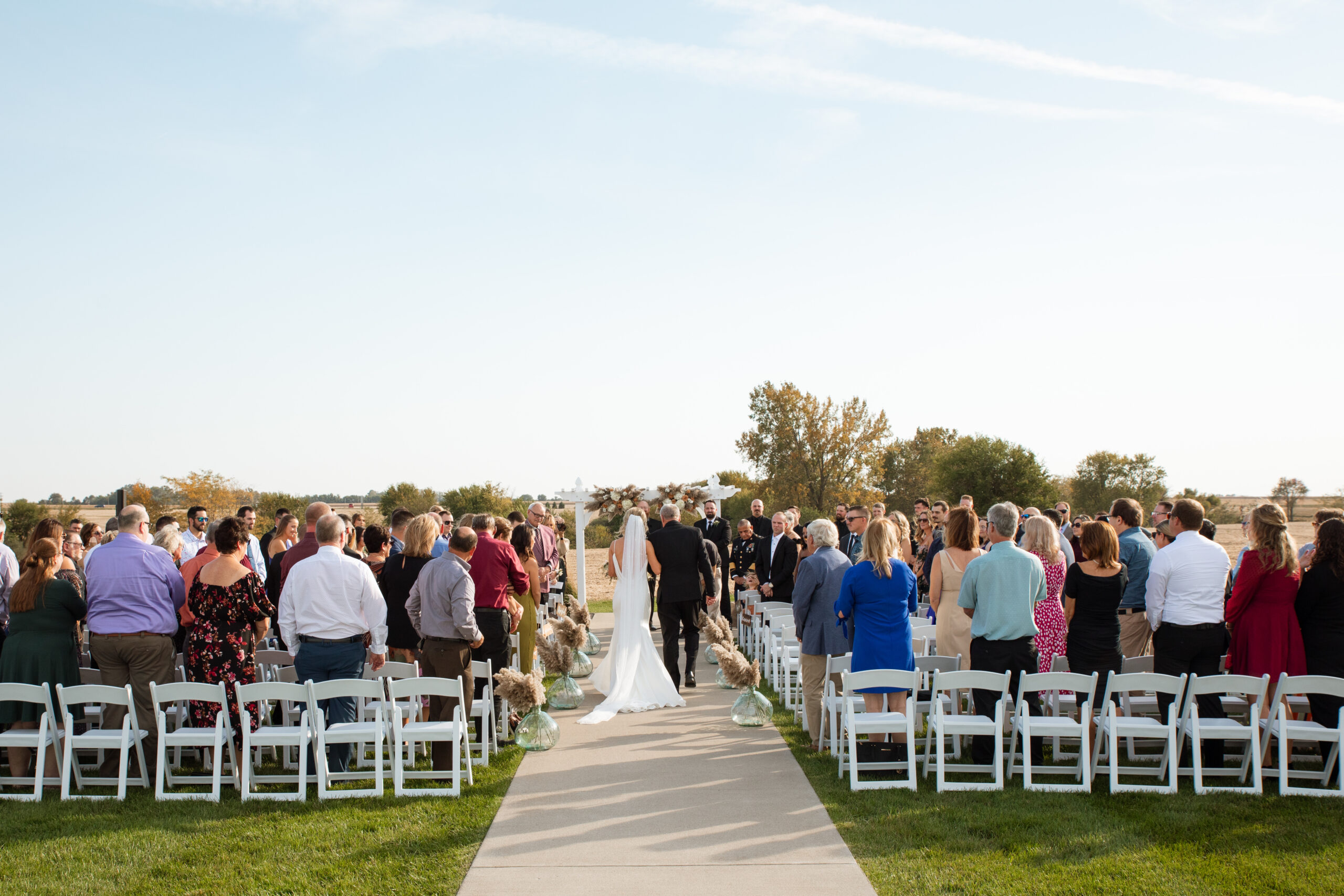 bride walking down the aisle with her father